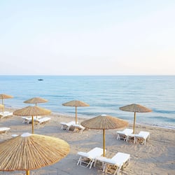 On the beach, sun loungers, beach umbrellas, beach towels