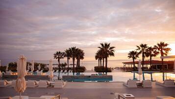 2 outdoor pools, pool umbrellas, pool loungers