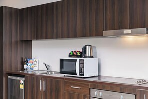 Studio, 1 King Bed, Balcony | Private kitchenette | Coffee/tea maker, electric kettle, eco-friendly cleaning products