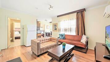 Comfort Two-bedroom Family Suite | Living area | 32-inch LCD TV with digital channels, TV