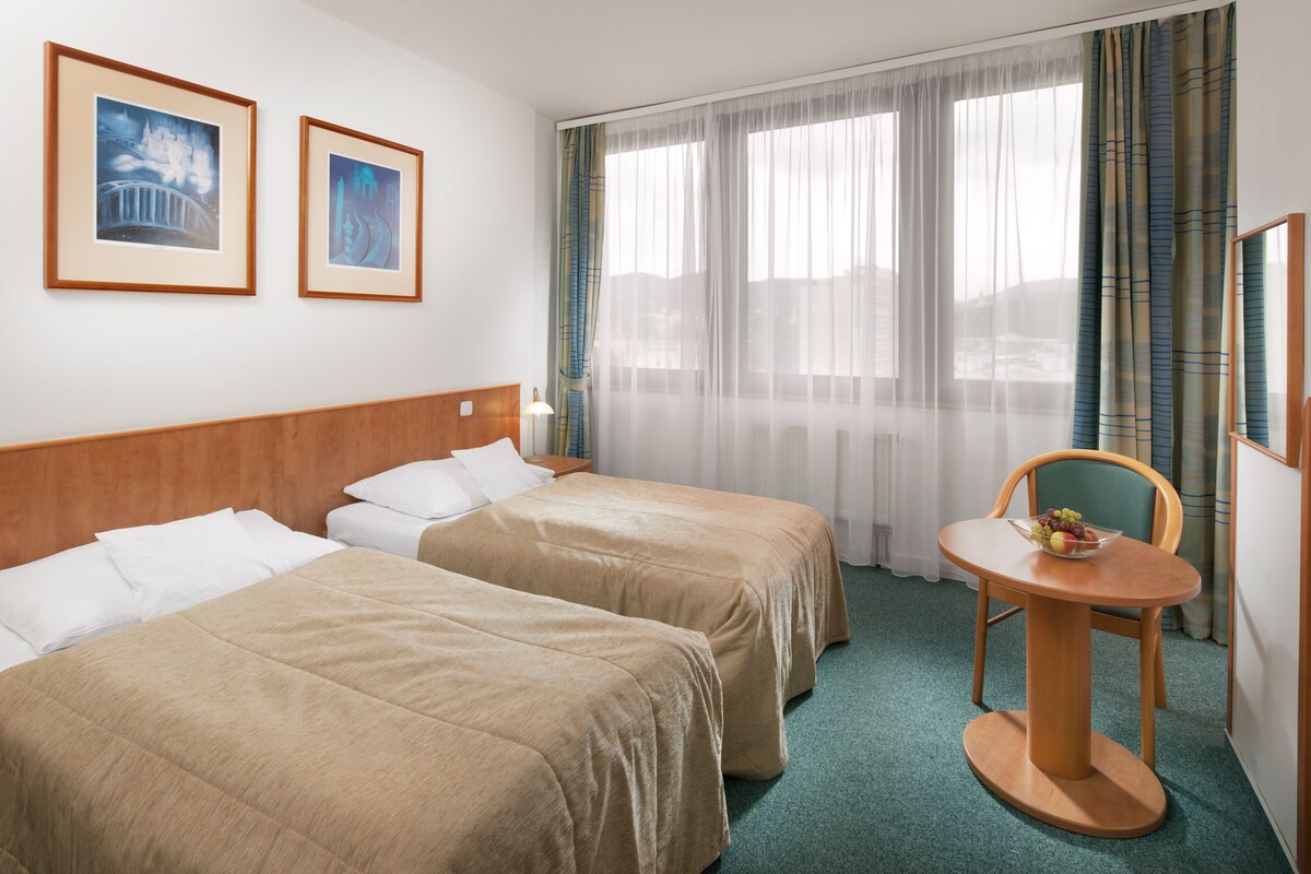 Standard Double or Twin Room | In-room safe, desk, laptop workspace, blackout curtains