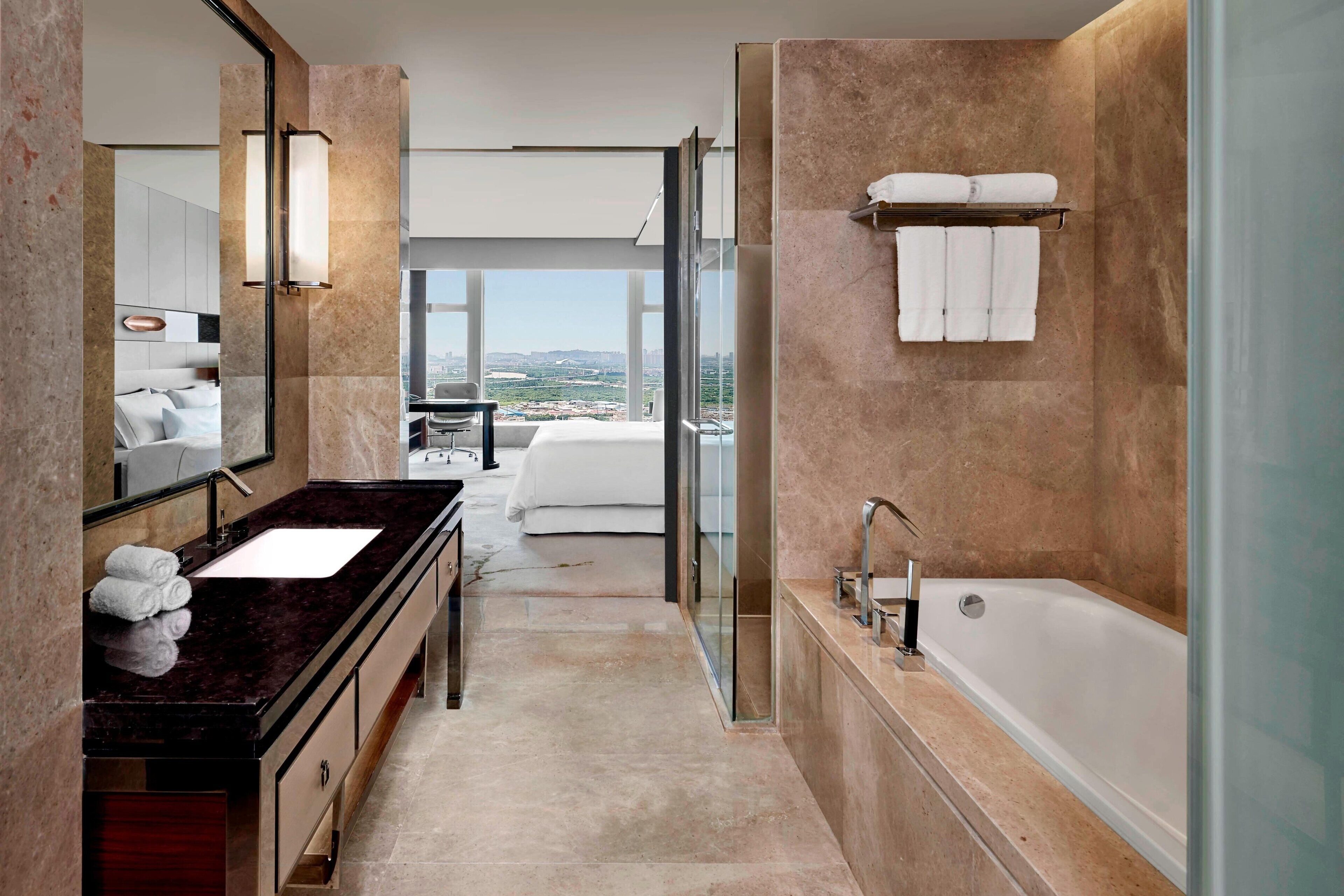 separate bathtub and shower, deep-soaking bathtub, rainfall showerhead