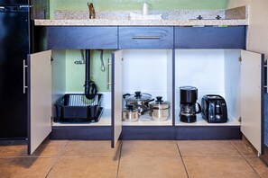 Full-size fridge, microwave, stovetop, coffee/tea maker