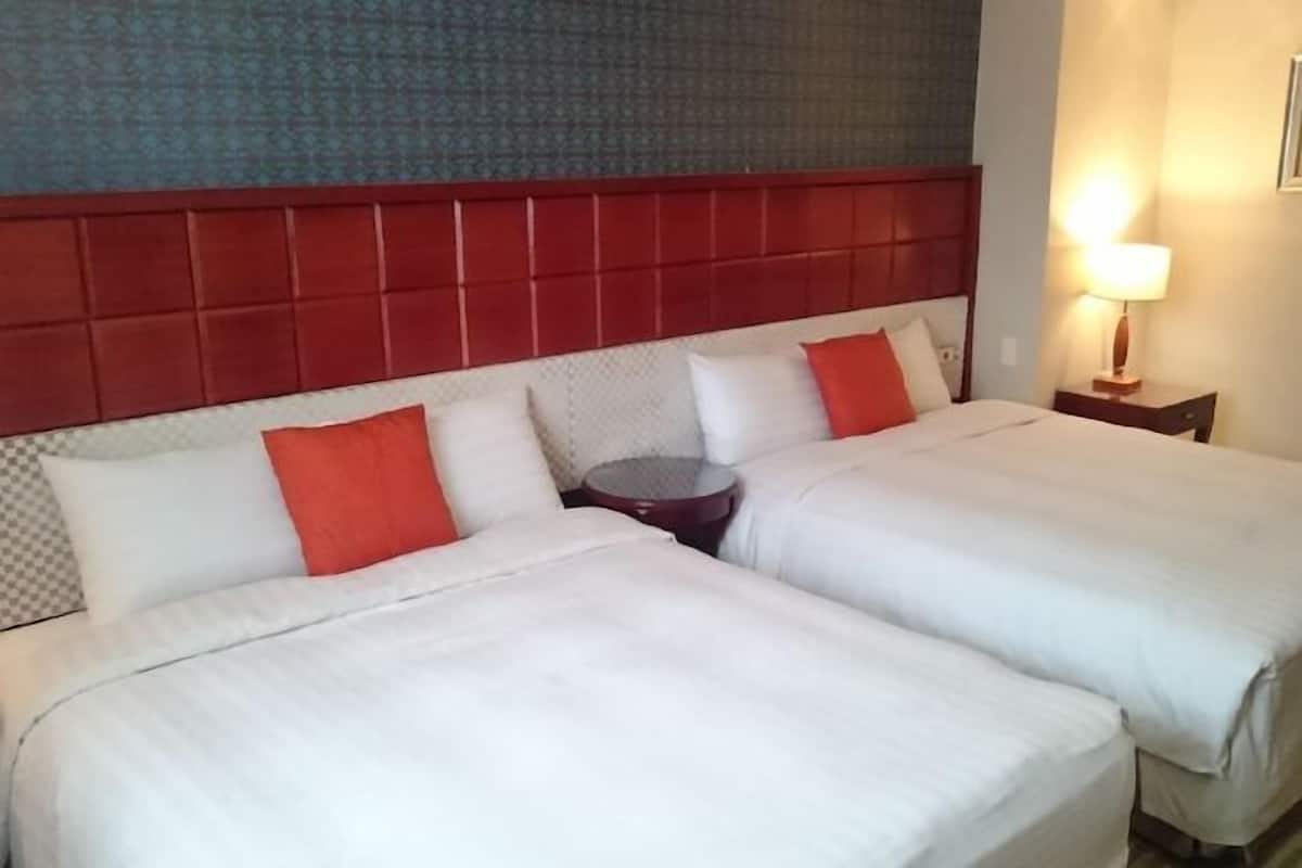 Luxe beddengoed, donzen dekbedden, pillowtop-bedden, een gratis minibar