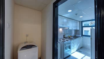 Fridge, microwave, electric kettle, cookware/dishes/utensils