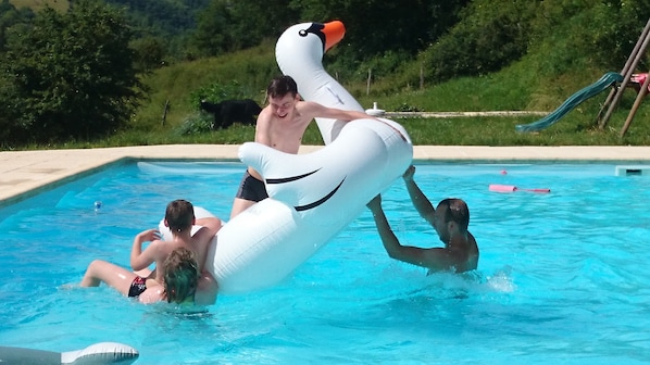 Seasonal outdoor pool, pool umbrellas, pool loungers