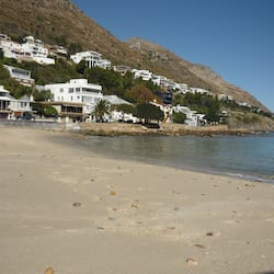 Beach nearby, white sand, beach towels