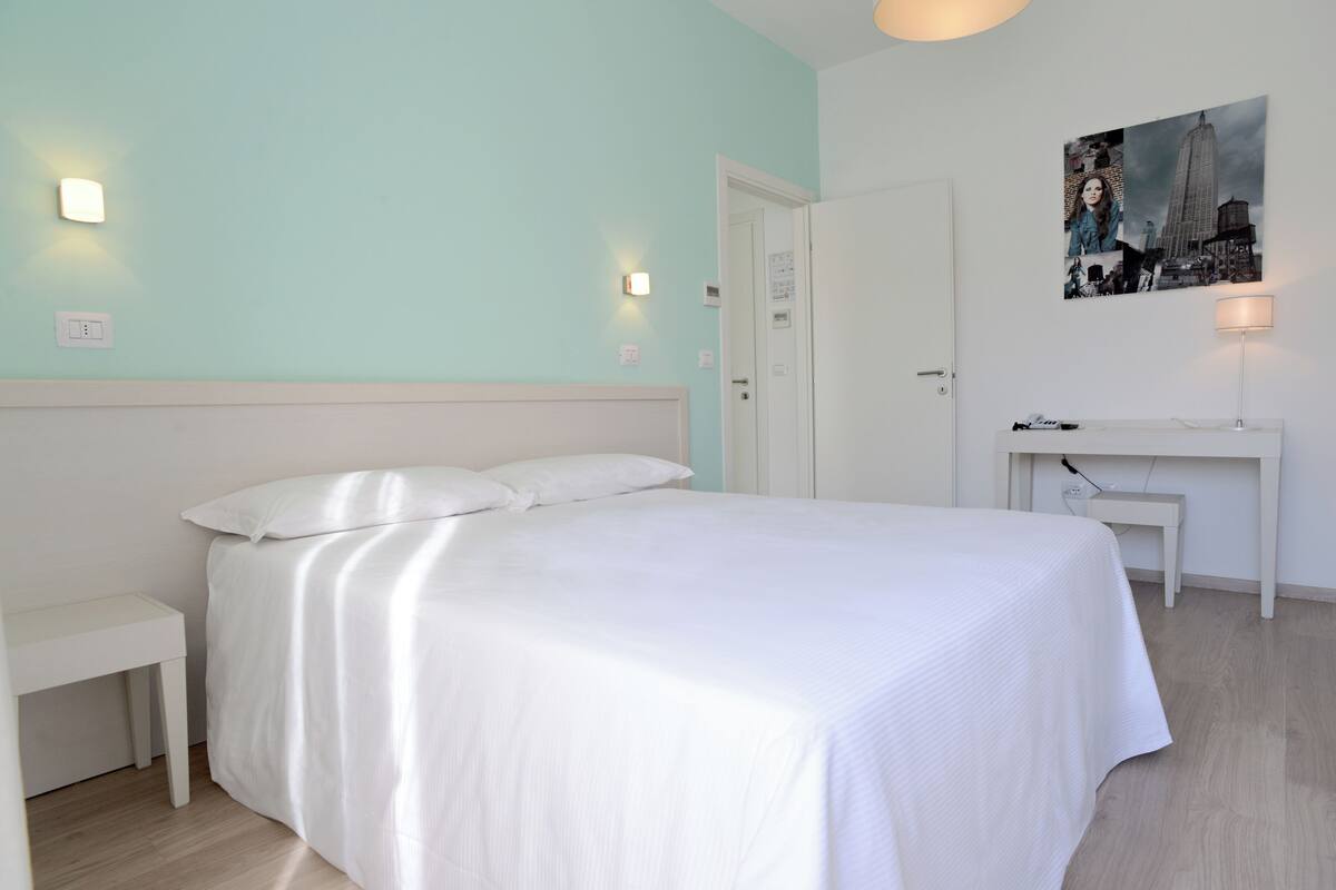 Suite | Egyptian cotton sheets, premium bedding, down comforters, desk
