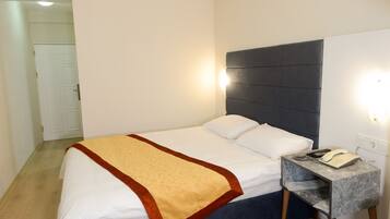 Premium bedding, free minibar items, desk, free WiFi