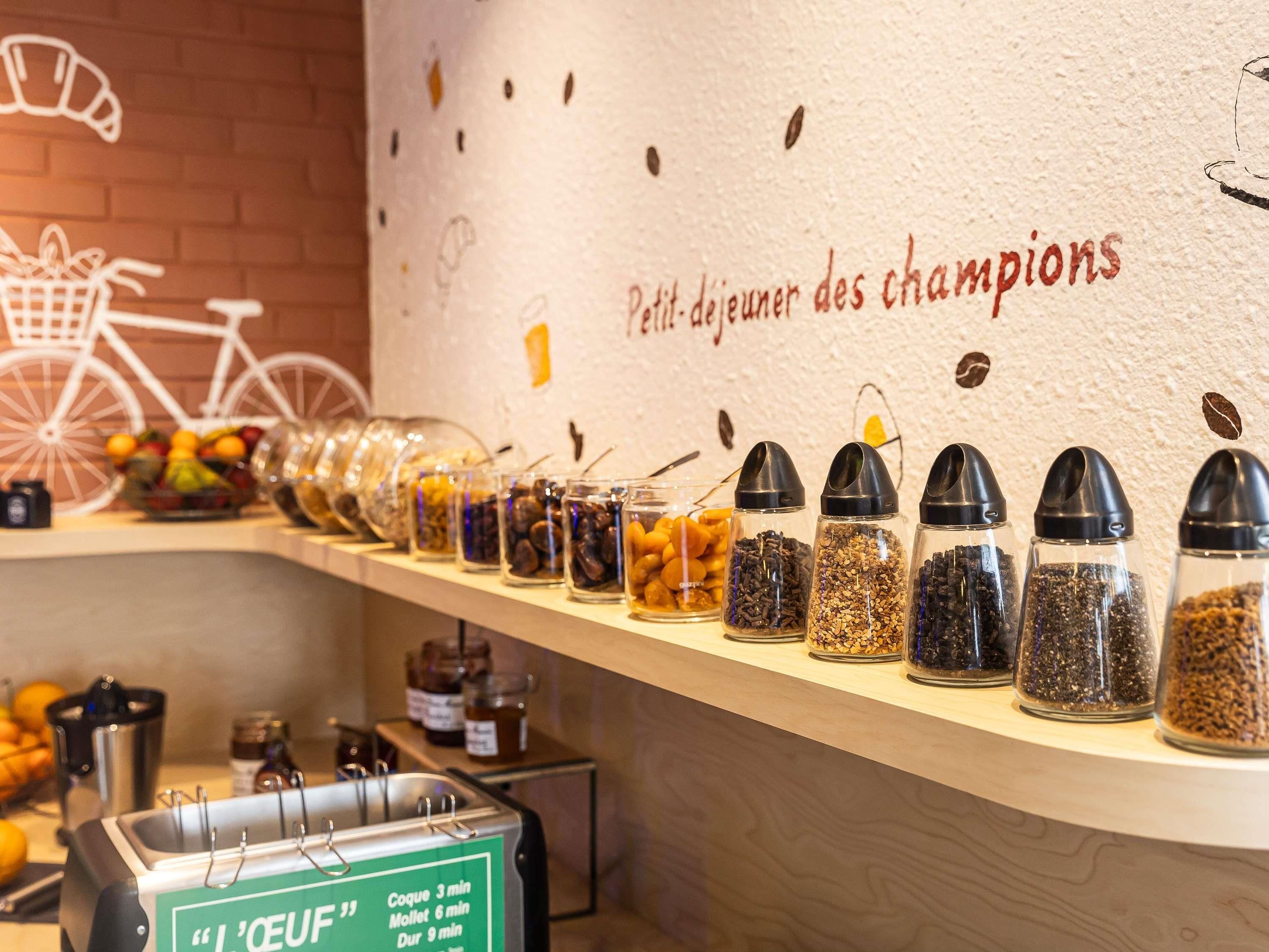 A food station with various jars of spices and condiments.