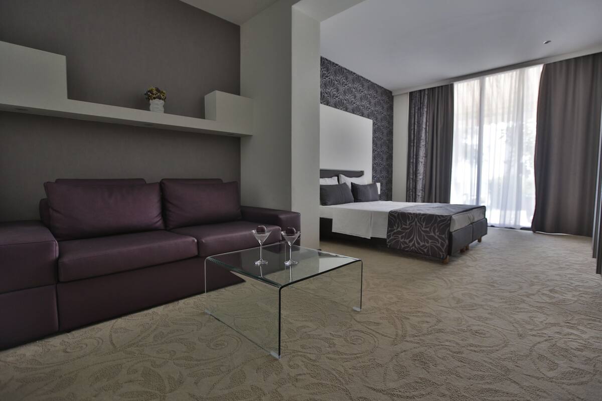 classic double room, balcony, sea view | living area | 85-cm lcd tv with satellite channels, tv