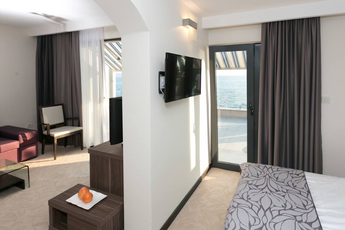 superior apartment, terrace, sea view | living room | 85-cm lcd tv with satellite channels, tv