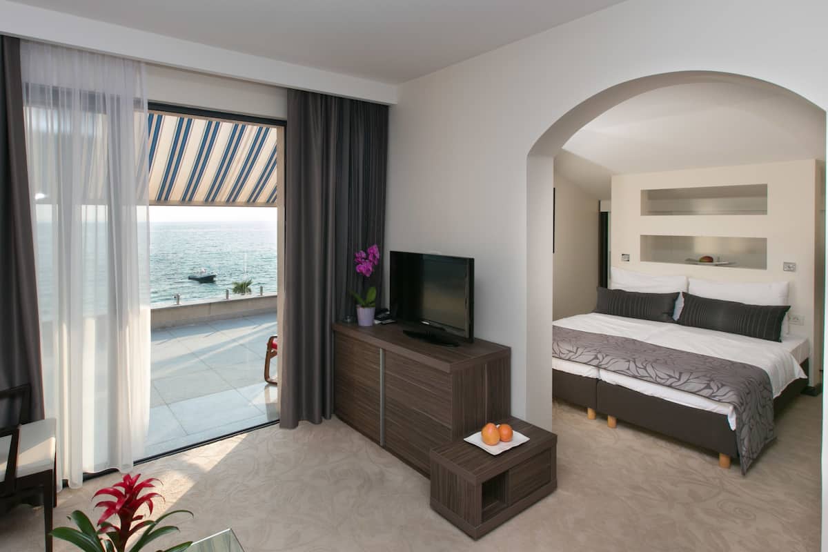 superior apartment, terrace, sea view | living room | 85-cm lcd tv with satellite channels, tv