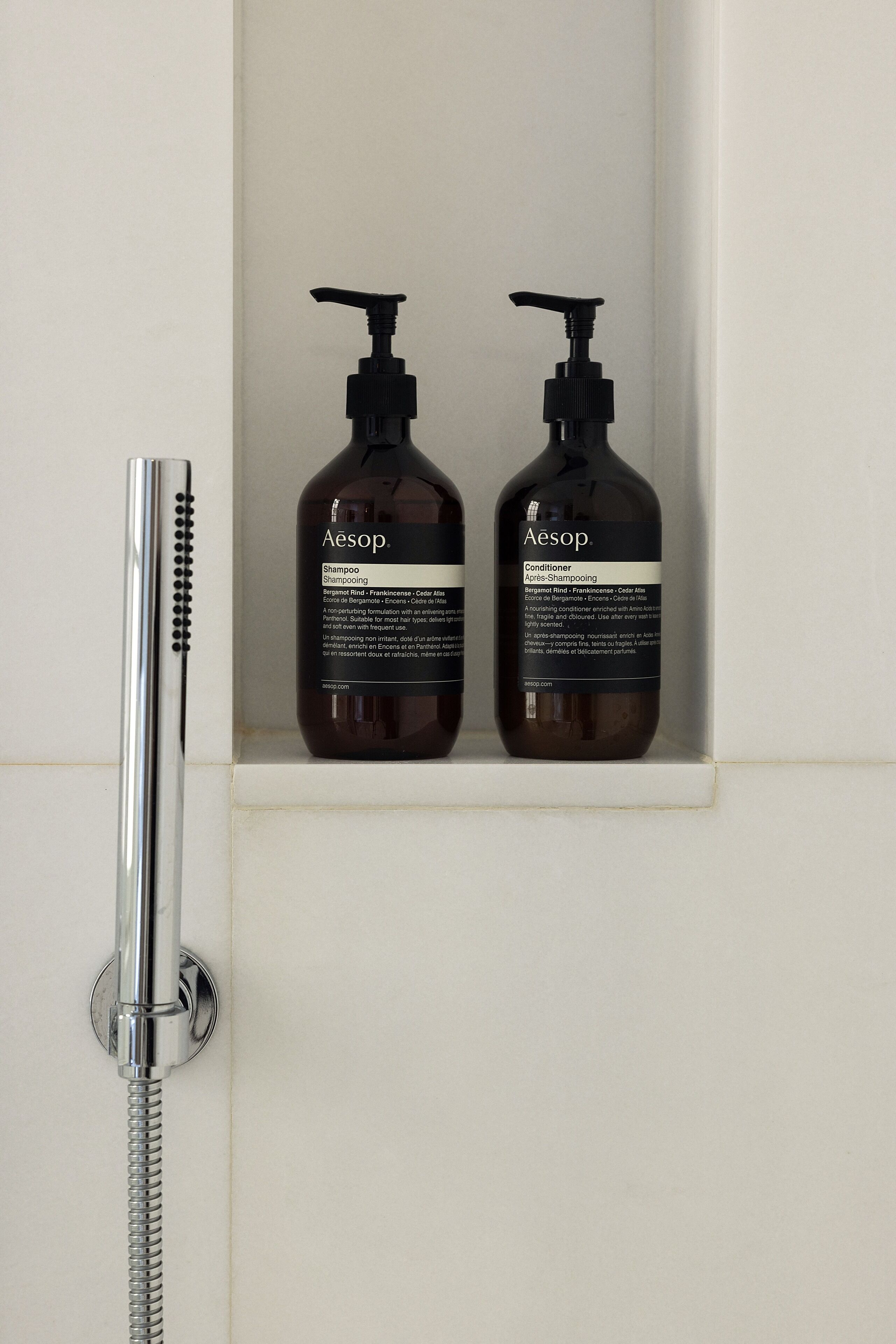 designer toiletries, hair dryer, bathrobes, slippers