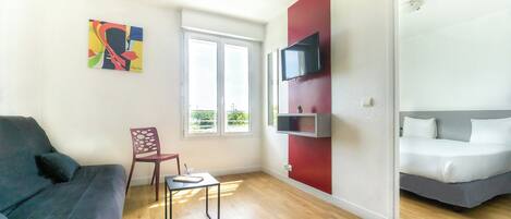 Standard Apartment | Living area | Flat-screen TV, offices