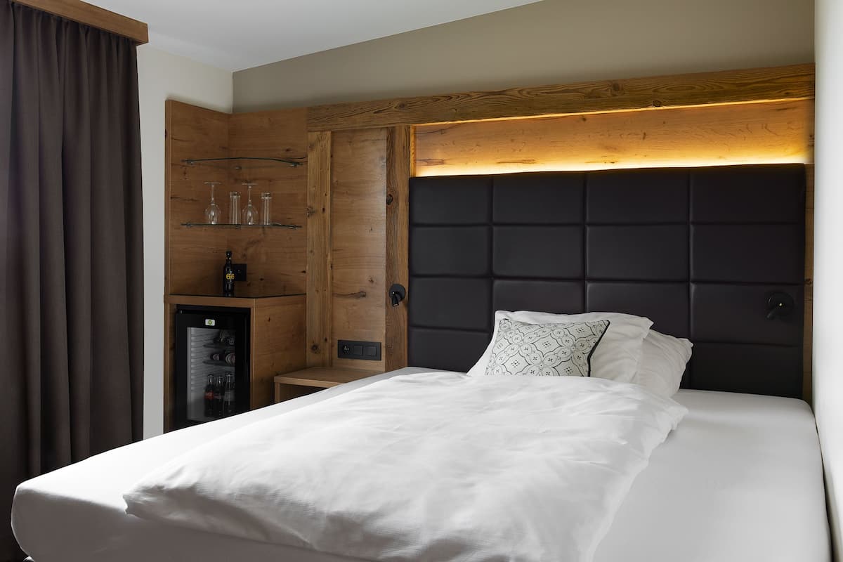 Chambre Simple (Kuschelnest) | Couette en duvet d'oie, minibar, coffres-forts dans les chambres, bureau