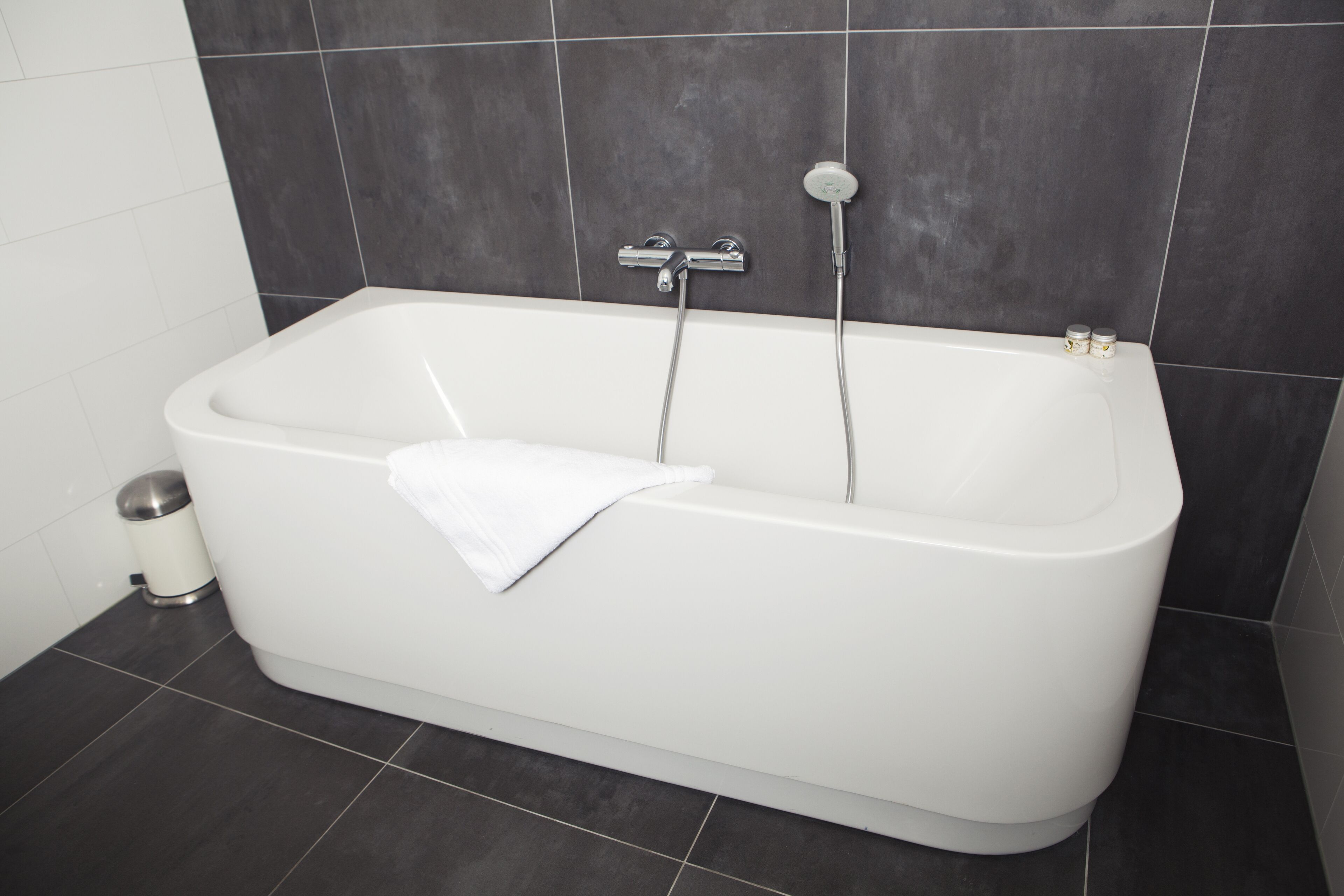 deluxe studio suite | bathroom | hair dryer, towels