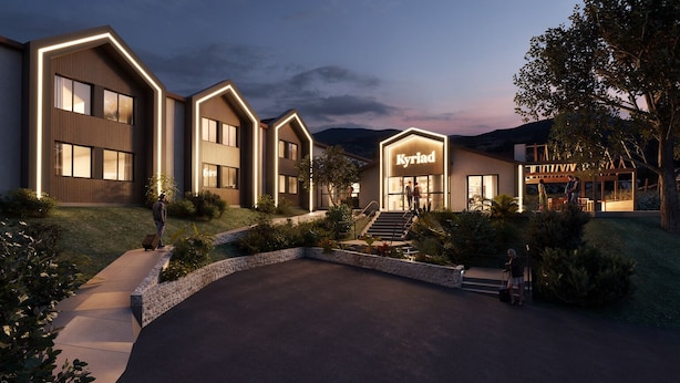 A modern hotel with a prominent entrance, outdoor seating area, and a well-maintained garden. - Kyriad - L'Isle-D'Abeau Bourgoin-Jallieu (L'Isle-d'Abeau)
