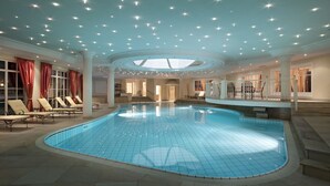 An indoor swimming pool with a skylight, lounge chairs, and a ceiling with star-like lights. - TH Corvara - Greif Hotel (Corvara in Badia)