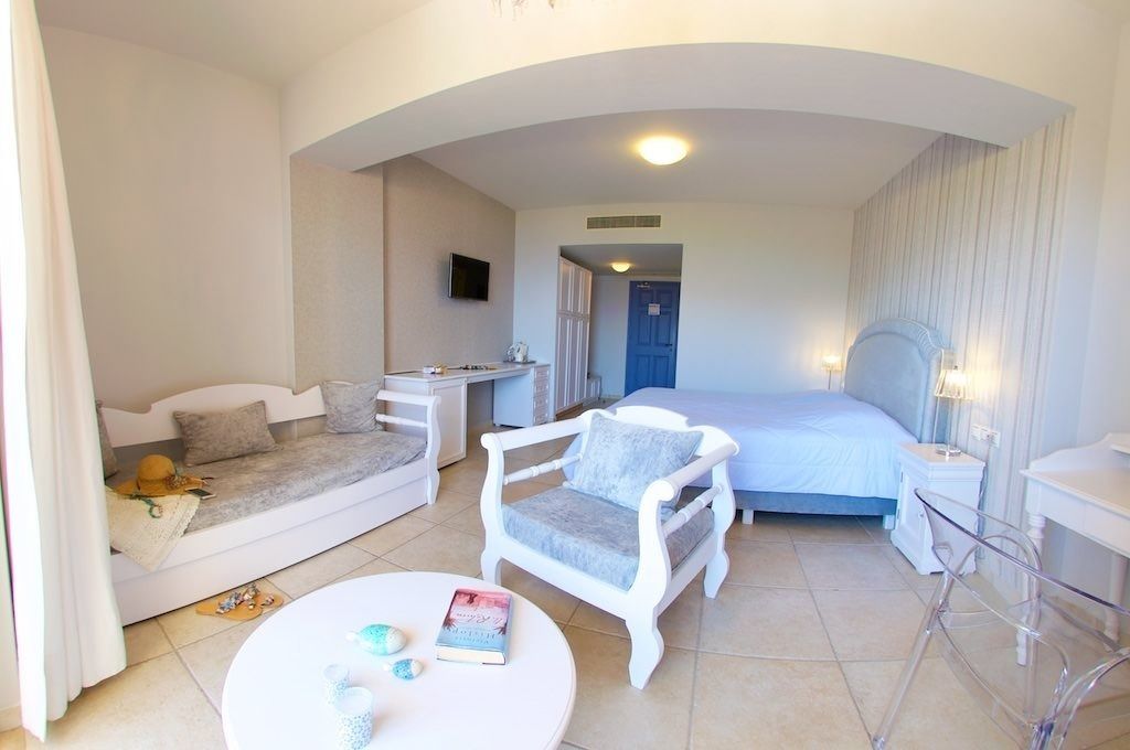 deluxe quadruple room | premium bedding, minibar, in-room safe, individually decorated