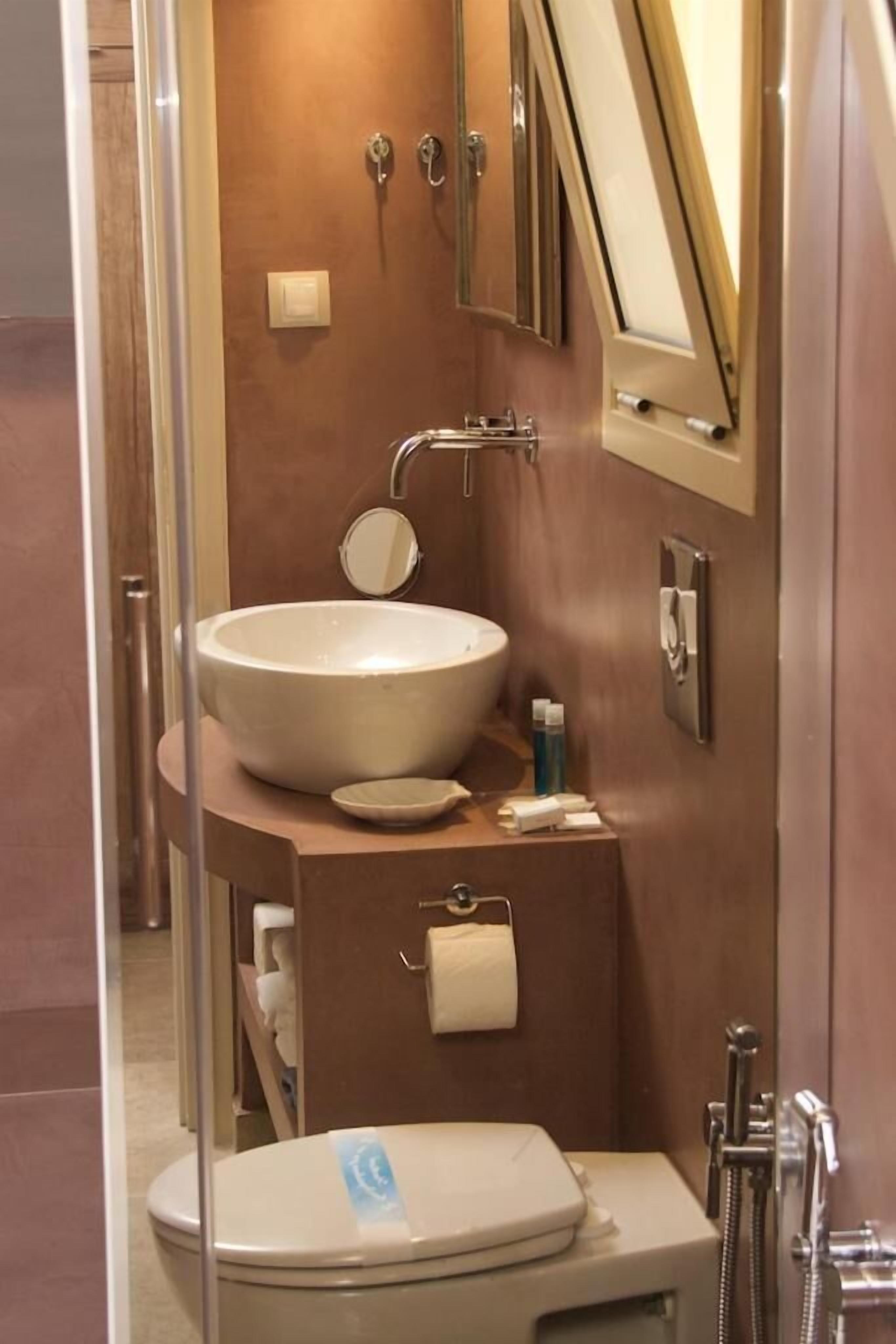 combined shower/bathtub, deep-soaking bathtub, designer toiletries