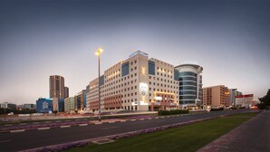 A hotel with multiple floors, a prominent Citymax sign, and a Dhow Palace Hotel sign. - Citymax Bur Dubai (Dubai)
