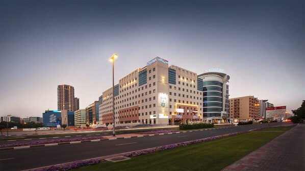 A hotel with multiple floors, a prominent Citymax sign, and a Dhow Palace Hotel sign. - Citymax Bur Dubai (Dubai)
