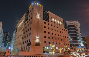 A hotel with multiple floors, a prominent entrance, and a well-lit facade. - Citymax Bur Dubai (Dubai)