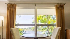 Standard, One King Bed, River View | Premium bedding, pillowtop beds, desk, laptop workspace