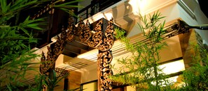 A building with ornate architectural details, including a decorative archway and a staircase. - Nicha Hua Hin Hotel (Hua Hin)