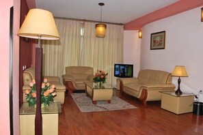 Deluxe Apartment, 3 Bedrooms | Living area | Flat-screen TV - Archi Hotel-Apartment (Addis Ababa)
