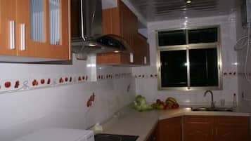 Deluxe Apartment, 3 Bedrooms | Private kitchen | Fridge, microwave, coffee/tea maker