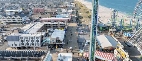 A boardwalk with a Ferris wheel, a carousel, and a casino.