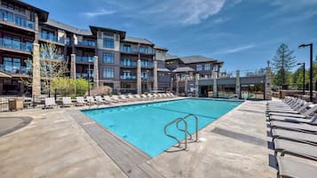 Outdoor pool, open 9:00 AM to 9:00 PM, pool umbrellas, pool loungers