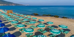Private beach, black sand, sun-loungers, beach umbrellas