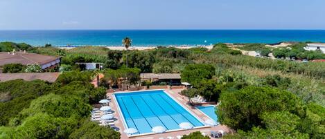 Seasonal outdoor pool, open 9:00 AM to 7:30 PM, pool umbrellas