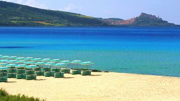 Private beach, black sand, sun-loungers, beach umbrellas