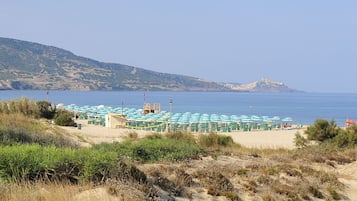 Private beach, black sand, sun loungers, beach umbrellas