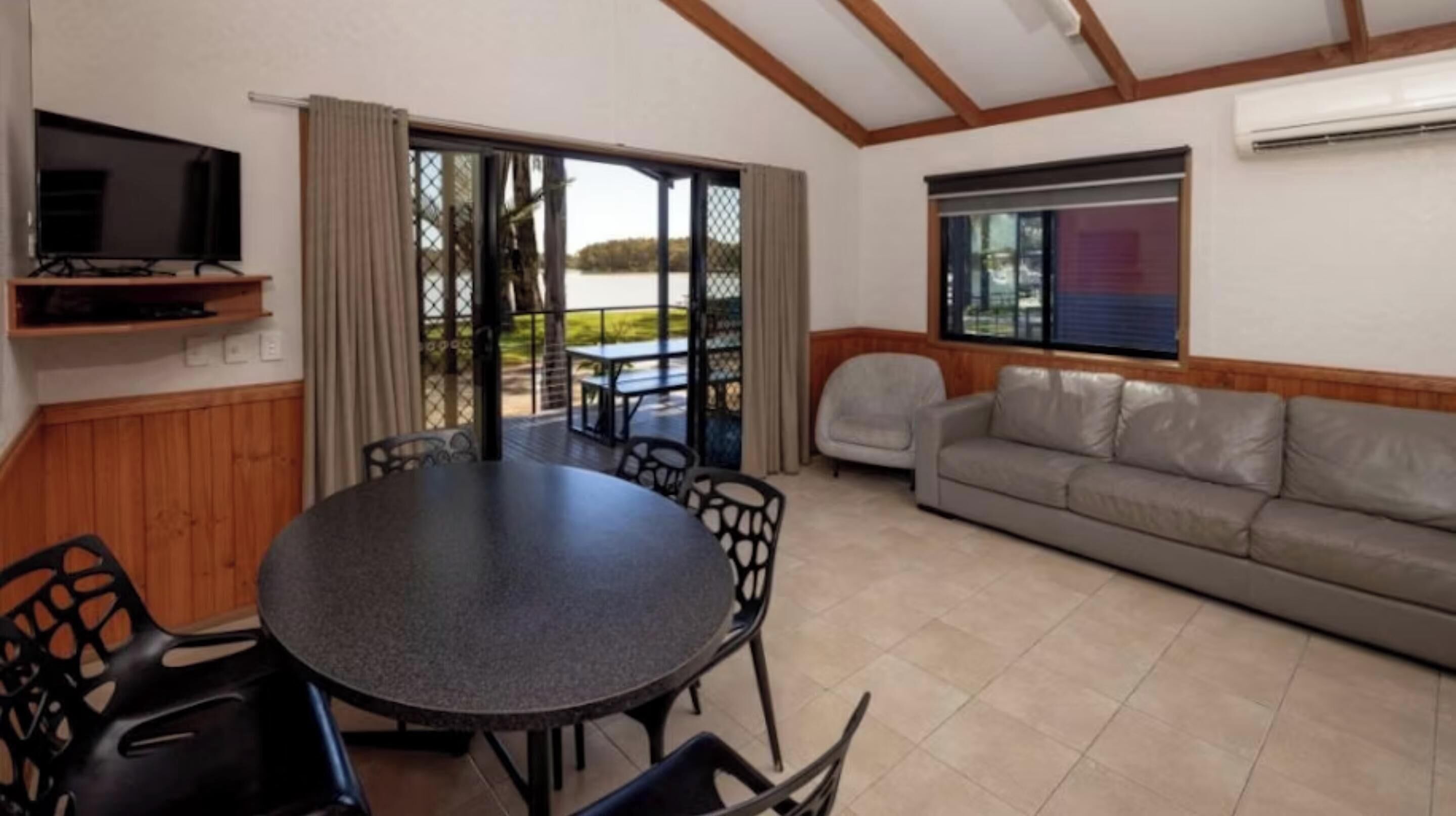 Superior 2 Bedroom Riverfront Cabin - Sleeps 5 | Living area | 52-cm TV with digital channels