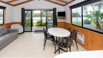 Superior 2 Bedroom Riverfront Cabin - Sleeps 6 | Living area | 52-cm TV with digital channels