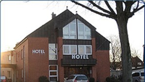 A two-story building with a prominent 'HOTEL' sign on the front. - Einfelder Hof (Neumuenster)