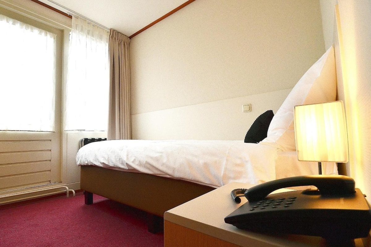 desk, blackout curtains, iron/ironing board, cots/infant beds