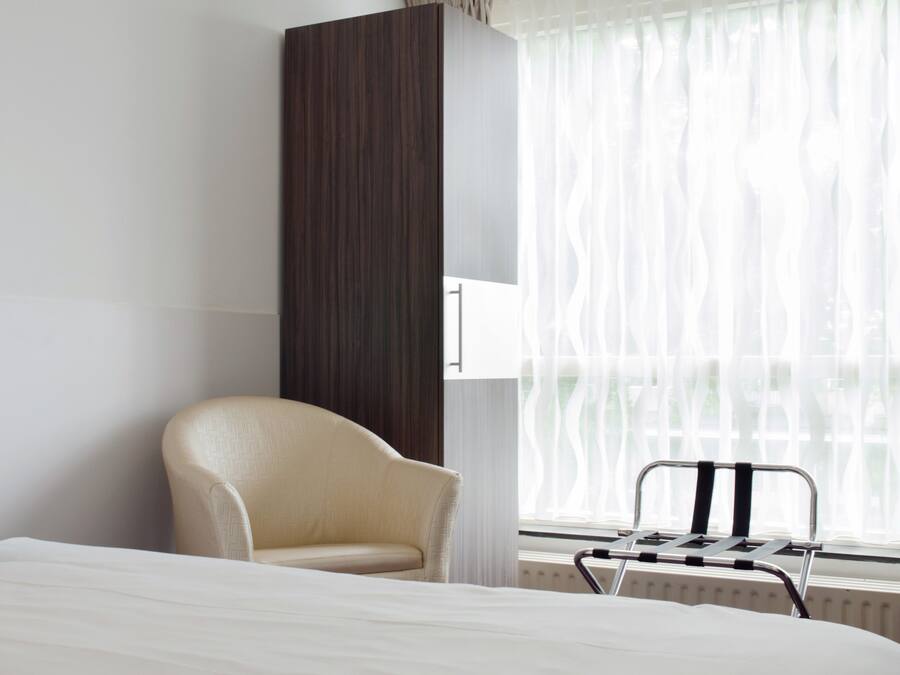 Standard Single Room | Desk, blackout curtains, iron/ironing board, cots/infant beds