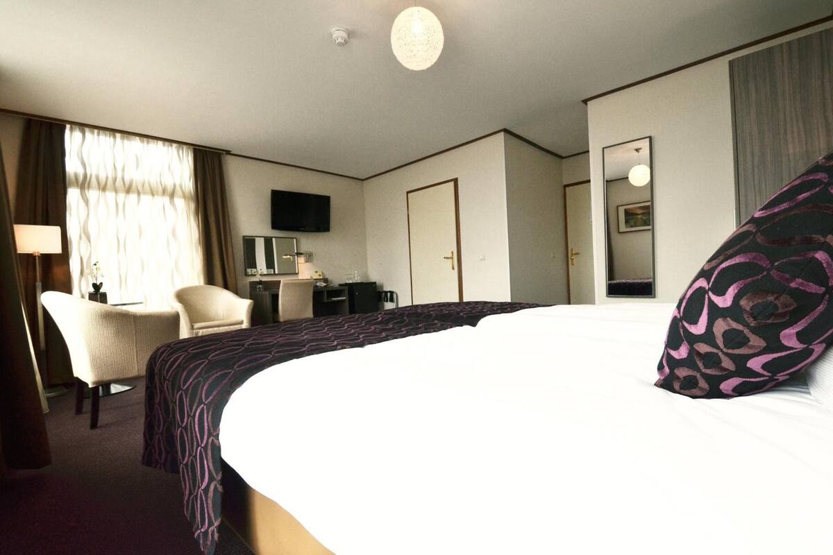 desk, blackout curtains, iron/ironing board, cots/infant beds