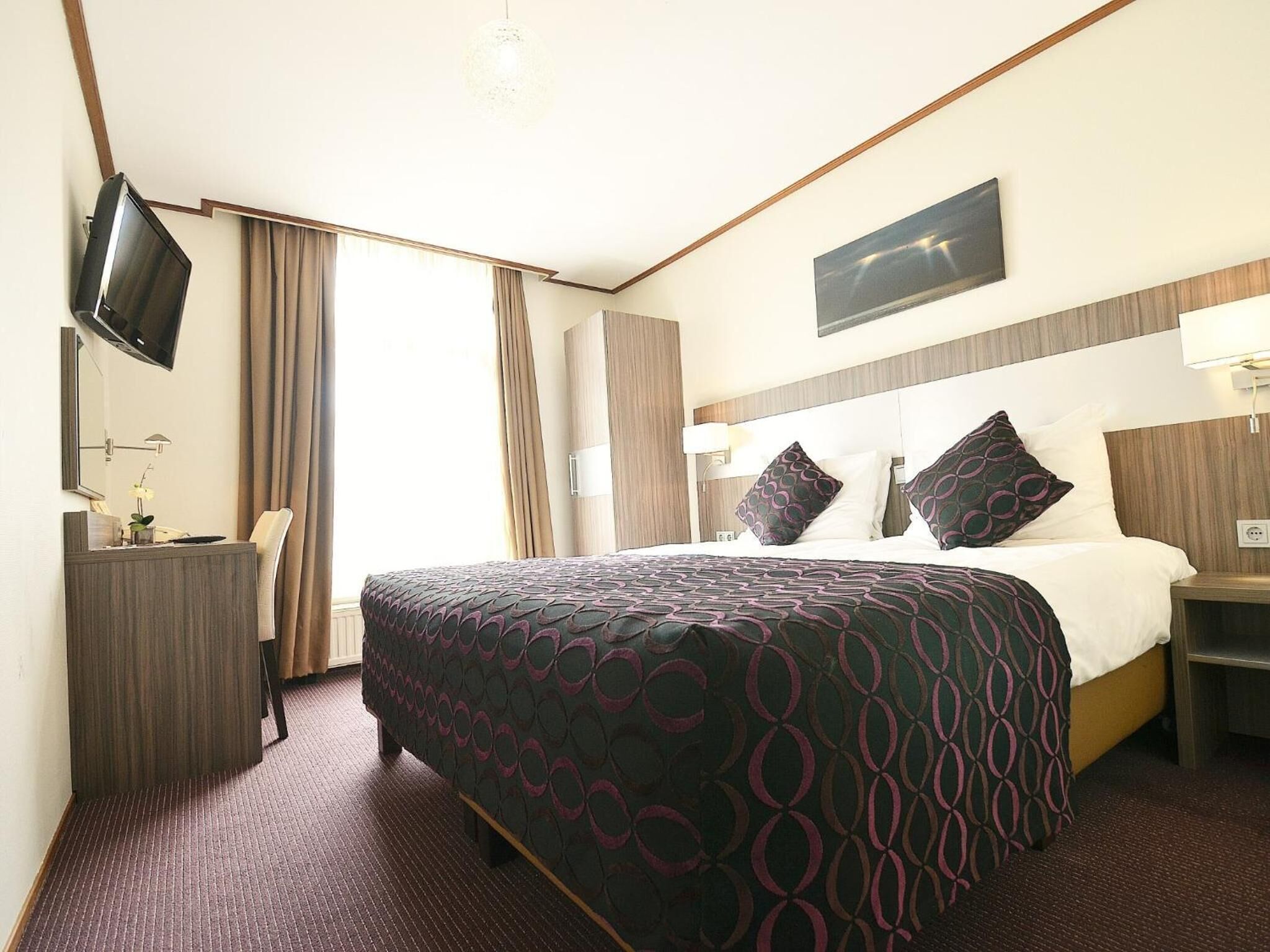 Desk, blackout drapes, iron/ironing board, cribs/infant beds