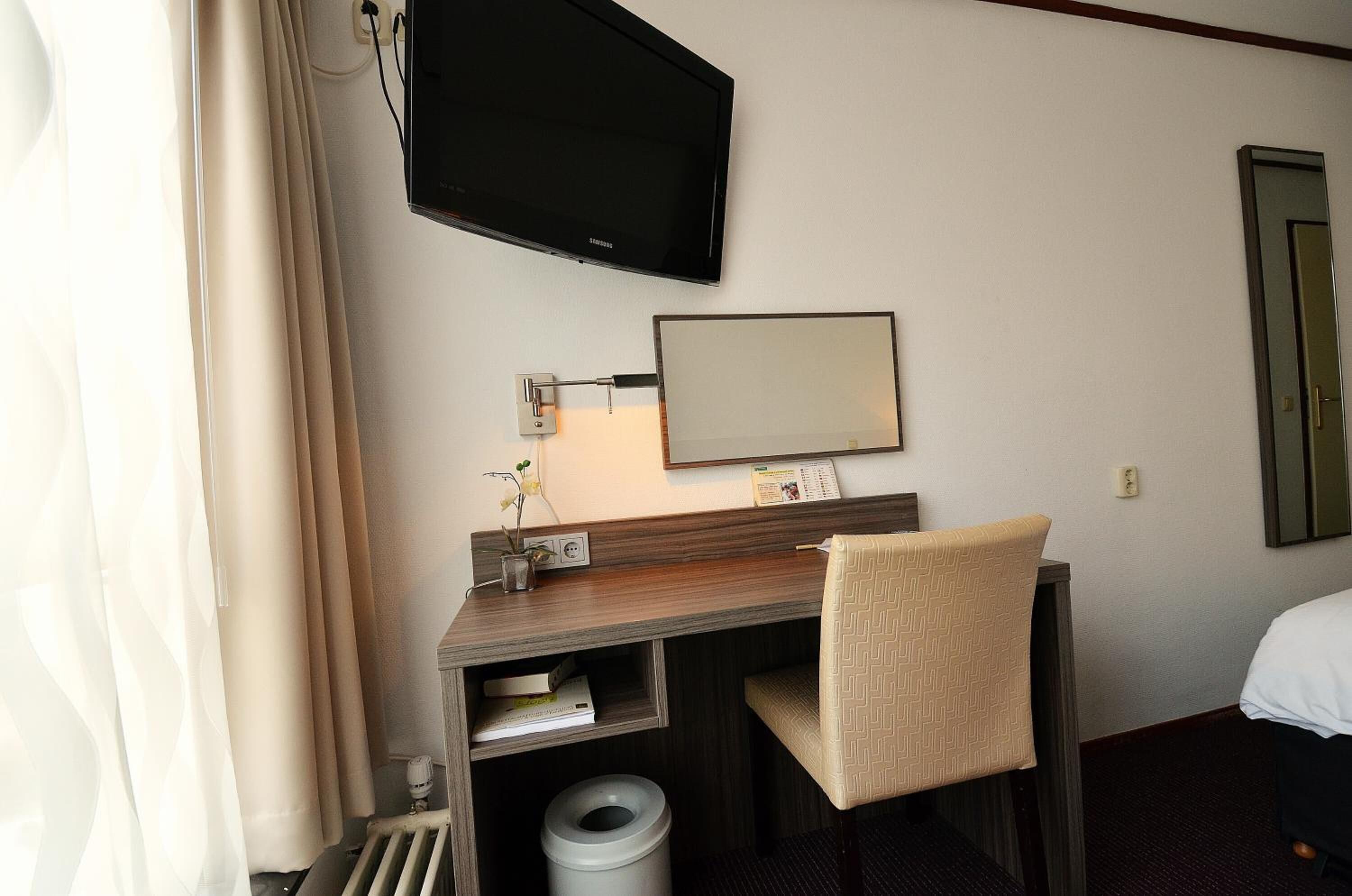 desk, blackout curtains, iron/ironing board, cots/infant beds