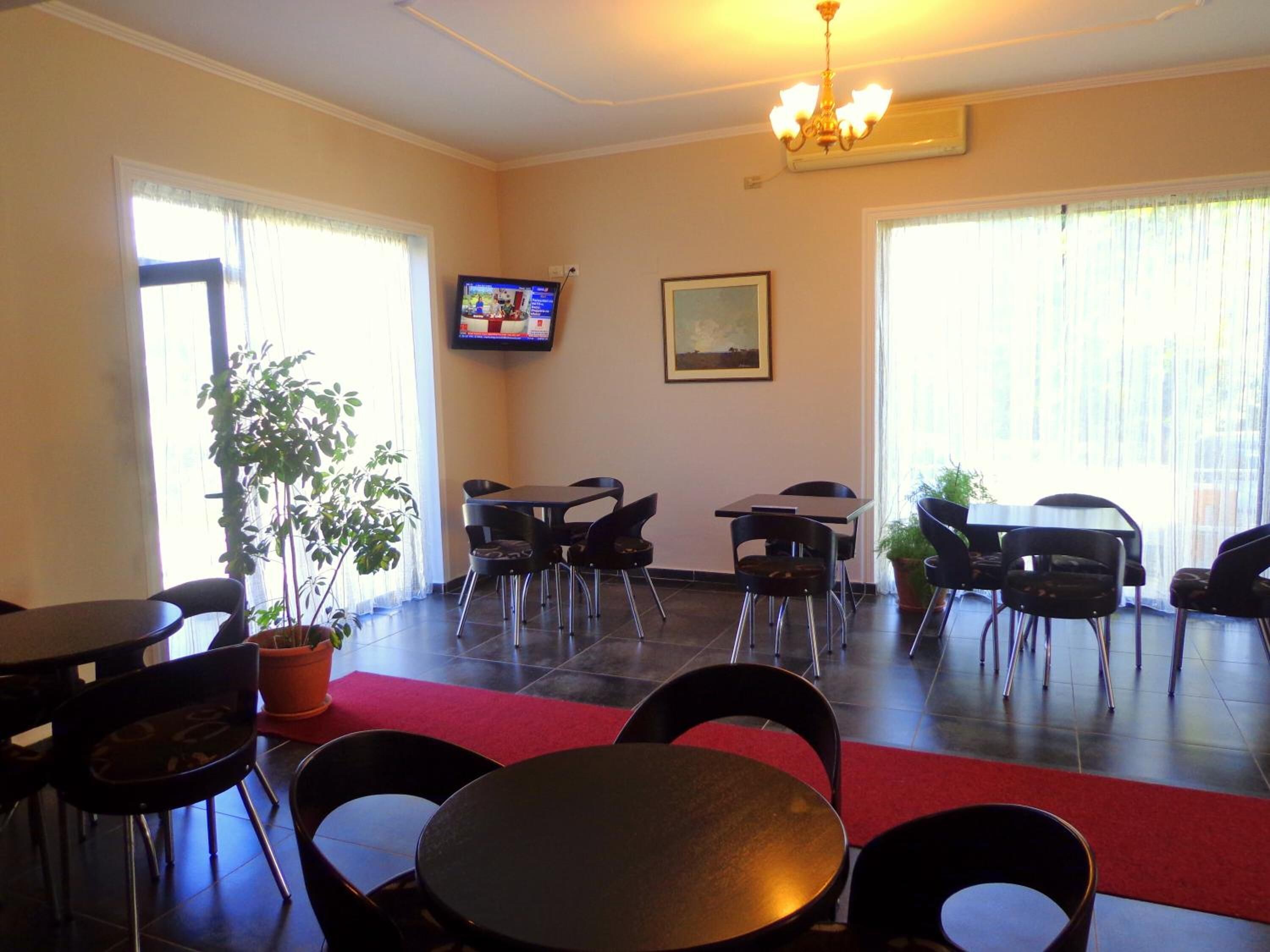 breakfast, lunch served; local and international cuisine, garden views