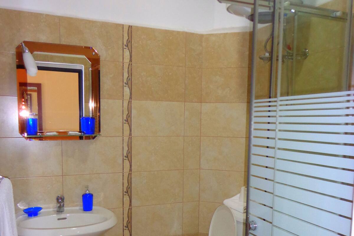 Shower, free toiletries, hair dryer, slippers