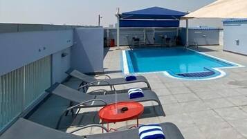 Outdoor pool, pool umbrellas, sun loungers