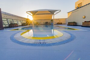 Outdoor pool, pool umbrellas, pool loungers